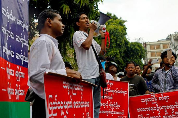 Activist U Thein Aung Myint (C) addresses a protest gathering in Mandalay on September 12, 2014. Photo: Pyae Sone Aung/EPA
