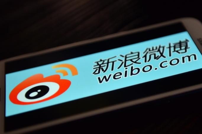 The logo of Chinese microblogging platform Weibo on a smartphone in the Chinese financial city of Shanghai. Photo: AFP