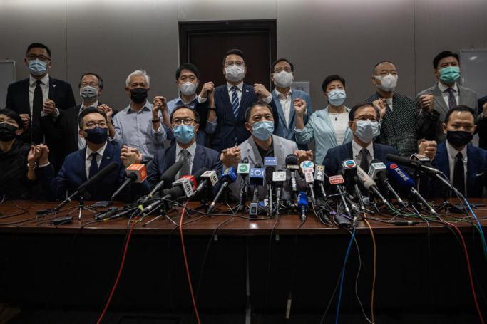 19 pan-democratic lawmakers attend a press conference in the Legislative Council in Hong Kong, China, 11 November 2020. Photo: EPA