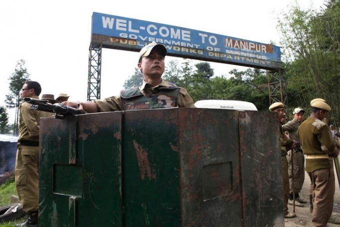 Indian security personal on guard duty at the Mao gate at the Nagaland-Manipur state border about 30 kms from Kohima, capital of Nagaland state, northeast India, May 7, 2010. Photo: EPA
