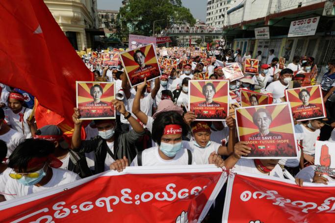 Demonstrators hold placards calling for the release of detained civilian leader Aung San Suu Kyi during a protest against the Myanmar military coup, in Yangon, Myanmar, 22 February 2021. Photo: Lynn Bo Bo/EPA