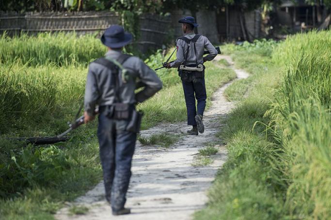 Armed police conduct search operations at Warpait village in Maungdaw, located in Rakhine State, on October 14, 2016 as the government announced that terror groups were behind the series of attacks. Photo: Ye Aung Thu/AFP
