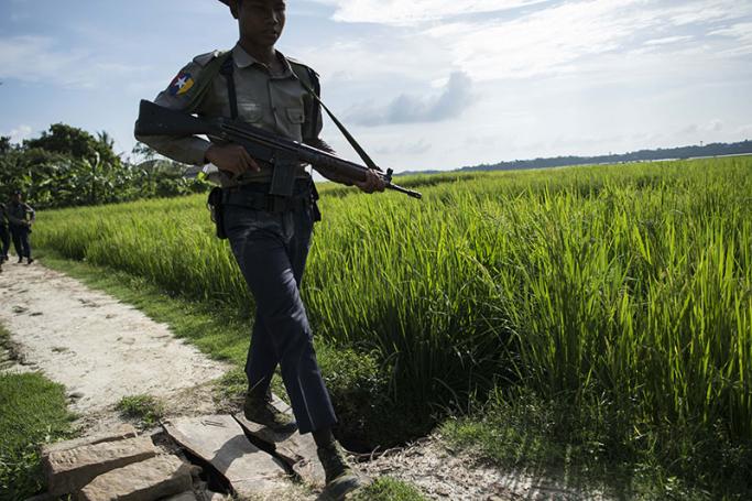 Armed police conduct search operations at Warpait village in Maungdaw, located in Rakhine State, on October 14, 2016 as the government announced that terror groups were behind the series of attacks. Photo: Ye Aung Thu/AFP

