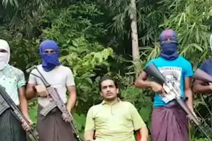 Ataullah Abu Amar Jununi, centre, heads the Arakan Rohingya Salvation Army. (ARSA video, YouTube screengrab)
