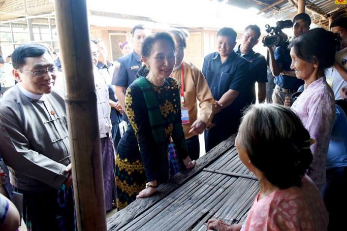 State Counsellor Daw Aung San Suu Kyi travelled to Myitkyina in Kachin State yesterday and visited a boarding school for students from the hilly regions, a drug rehabilitation center donated by the Daw Khin Kyi Foundation, and IDP camps in the area, where she provided them with necessities. Photo: Myanmar State Counsellor Office