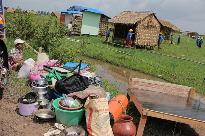 Authorities demolish huts and houses at a slum area in Hlegu Township, outskirt of Yangon on 12 June 2017. Photo: Thura/Mizzima
