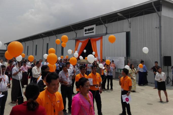 Guests mingle on Friday at the brand new BASF construction chemicals production facility in Yangon's East Dagon Industrial Zone. Photo: Evan Erickson for Mizzima
