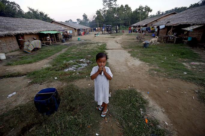 A young girl at the Min Gan temporary refugee camp, Sittwe, Western Myanmar. Photo: Nyein Chan Naing/EPA
