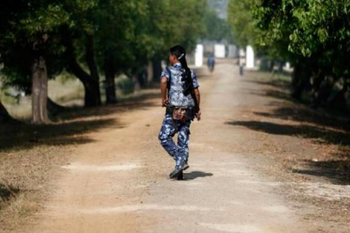 File Photo: An armed policeman walks by the gate near Taungpyo Bangladesh-Myanmar border entrance in Maungdaw district, Rakhine State of western Myanmar. / Photo: EPA