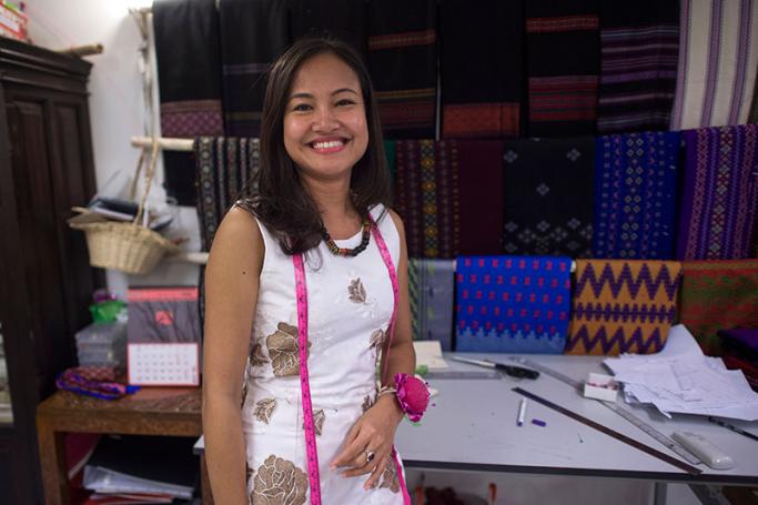 This photo taken on July 5, 2017 shows boutique owner Pyone Thet Thet Kyaw (R), owner and designer of Virya Couture, posing at her shop at Yangon. With Myanmar emerging as a manufacturing hub for mass-produced clothes, a crop of young designers are using home-grown fashion to preserve the country's sartorial heritage and reshape the sweatshop model. Photo: Ye Aung Thu/AFP
