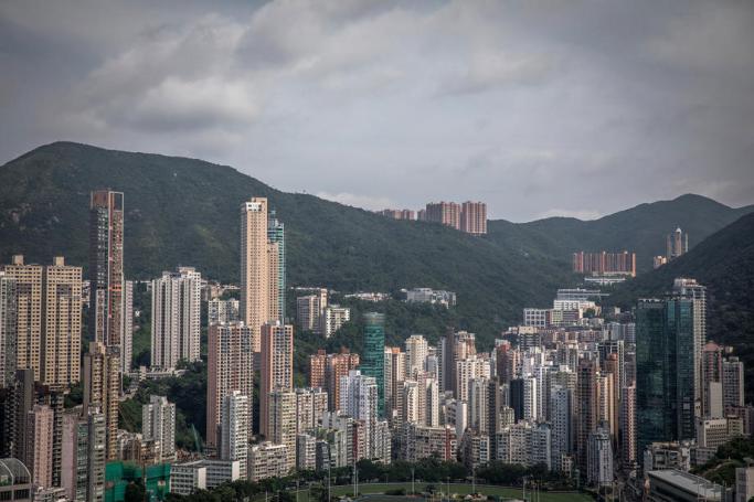 Commercial and residential buildings are seen in Hong Kong, China. Photo: Roman Pilipey/EPA