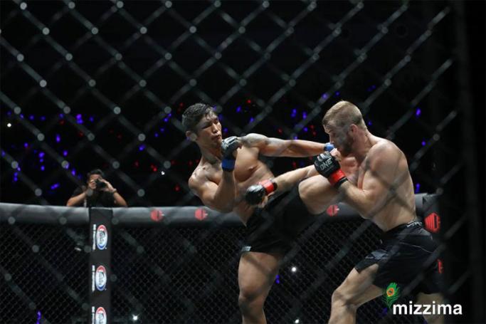 Aung La N Sang (left), also known as Burmese Python from Myanmar fights with Vitaly Bigdash (right) from Russia during their middleweight Mixed Martial Arts (MMA) ONE Championship bout at the Thuwanna indoor stadium in Yangon on 30 June 2017. Photo: Thet Ko/Mizzima
