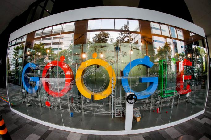 A picture made with a fisheye lens shows the Google logo. Photo: EPA