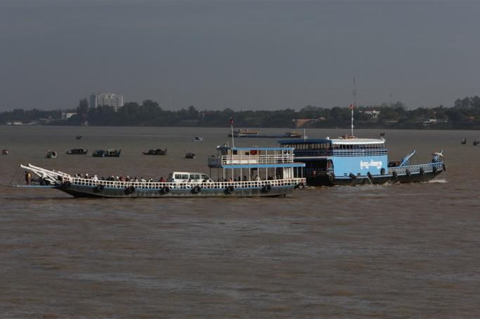 People travel along the Mekong River by boat, in Phnom Penh, Cambodia. Photo: EPA