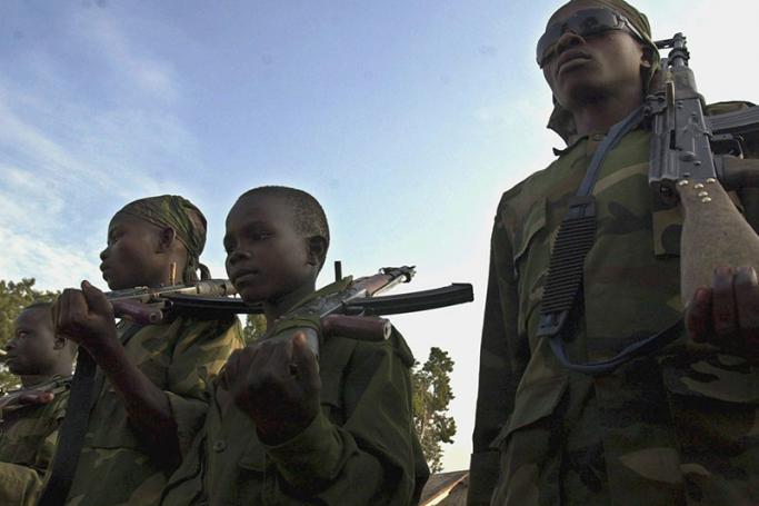 Child soldiers during drill exercises at an ethnic Hema militia camp near Bunia in the Democratic Republic of Congo, June 16, 2003. Photo: Stephen Morrison/EPA
