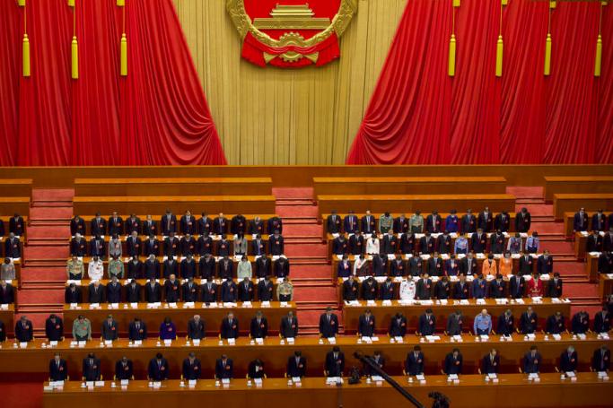Chinese leaders and delegates bow their heads during the opening session of China’s National People’s Congress (NPC) at the Great Hall of the People in Beijing, China, 22 May 2020. Photo: EPA