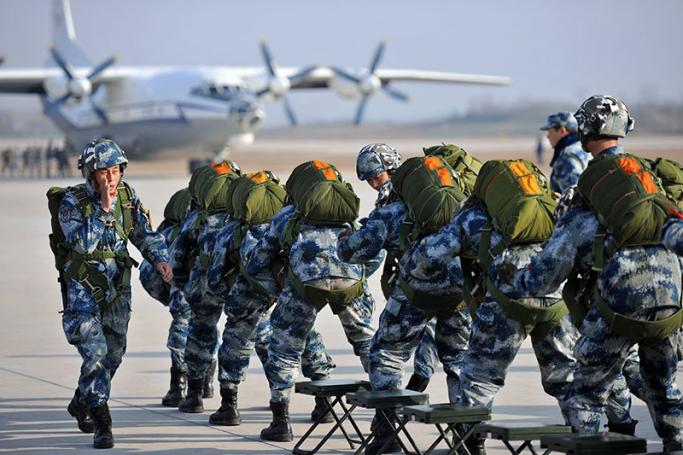 A picture made available on 20 January 2017 shows China's People's Liberation Army soldiers practice boarding a transport plane while participating in parachuting training in Hubei province, China, 16 January 2017. Photo: EPA
