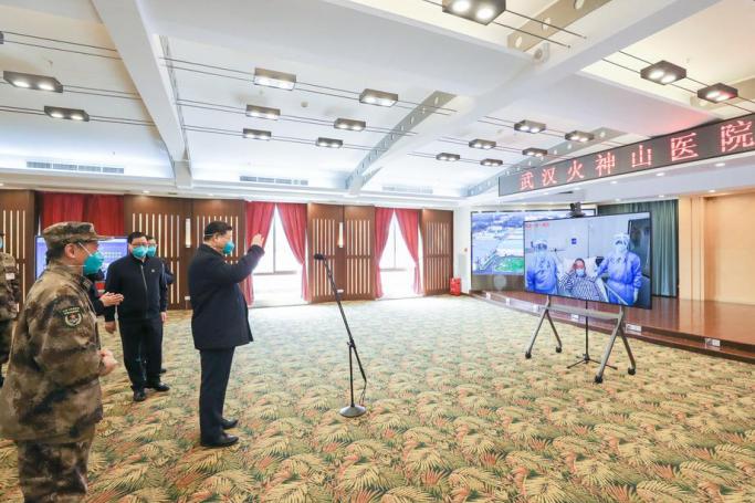 A picture released by Xinhua News Agency shows Chinese President Xi Jinping, also general secretary of the Communist Party of China Central Committee and chairman of the Central Military Commission, visiting patients who are being treated, by video calls at the Huoshenshan Hospital in Wuhan, central China's Hubei Province, 10 March 2020. Photo: EPA-EFE/XINHUA