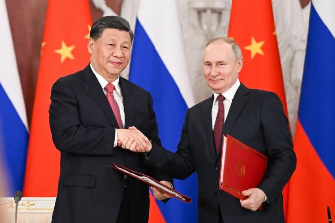Chinese President Xi Jinping and Russian President Vladimir Putin shake hands after jointly signing a Joint Statement of the People's Republic of China and the Russian Federation on 'Deepening the Comprehensive Strategic Partnership of Coordination for the New Era' and a Joint Statement of the President of the People's Republic of China and the President of the Russian Federation on 'Pre-2030 Development Plan on Priorities in China-Russia Economic Cooperation' in Moscow, Russia, 21 March 2023.Photo: EPA