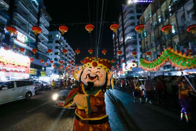 A performer wearing an imperial costume parades in the streets of Chinatown during celebrations for the upcoming Chinese Lunar New Year or Spring Festival in Yangon, Myanmar, 06 February 2018. Photo: Lynn Bo Bo/EPA-EFE
