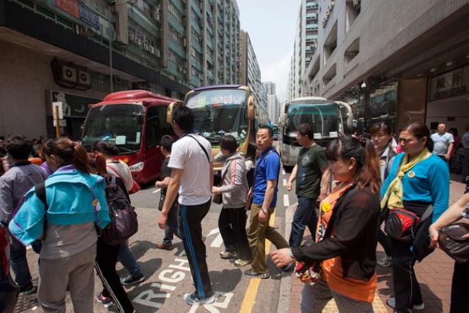 Tourists from mainland China on an organised shopping tour in Hung Hom, Kowloon, Hong Kong, China, April 17, 2014. Photo: Alex Hofford/EPA

