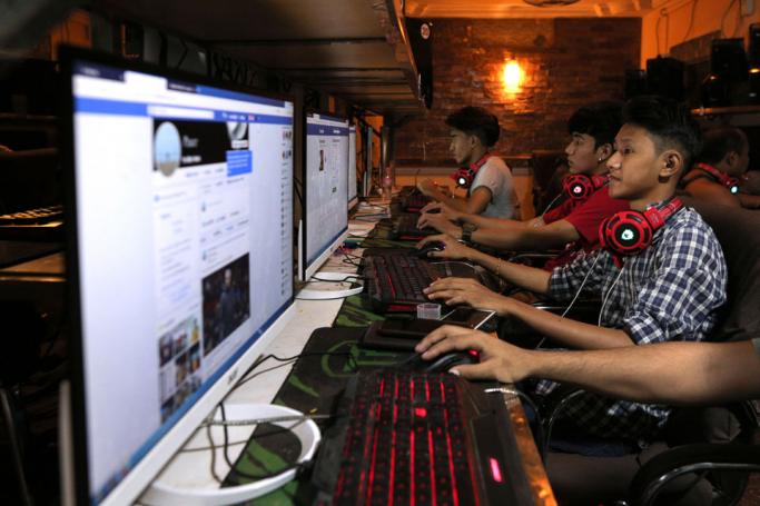 Computer users at an internet shop in Yangon. Photo: AFP