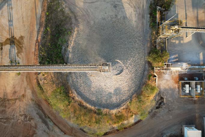 This aerial photo taken on March 22, 2023 shows crushed ore being dumped on the stockpile at the Akara Resources’ Chatree gold mine in Thailand's Phichit province. Photo by Lillian SUWANRUMPHA / AFP