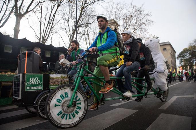 Demonstrators ride on a four person bike during a street parade for the COP21 in Montreuil in the East of Paris, France, 5 December 2015. Photo:Etienne Laurent/EPA
