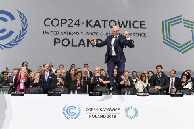 COP24 president Michal Kurtyka jumps at the end of the final session of the COP24 summit on climate change in Katowice, southern Poland, on December 15, 2018. Photo: Janek Skarzynski/AFP