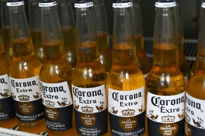 Since the start of the virus crisis, Corona beer has been the punchline of some questionable jokes and memes (AFP/File / Rodrigo ARANGUA)