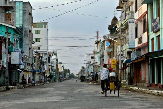 Rakhine State is the home to most of Myanmar's white card holders. A trishaw drives along the main road during the curfew time following communal violence in Sittwe, Rakhine State, Myanmar, June 17, 2012. Photo: Lynn Bo Bo/EPA
