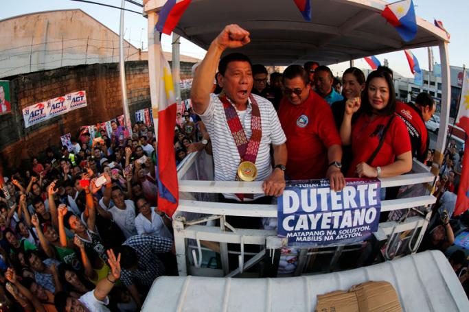 Filipino presidential candidate, Davao City Mayor Rodrigo Duterte (C) gesturing during an election campaign rally in Quezon City, east of Manila, Philippines. Duterte, 71 years old, nicknamed 'the punisher', has reportedly won widespread support for his tough-on-crime approach in one of Asia's most crime-ridden countries, and is the front-runner in the elections. Photo: Francis R. Malasig/EPA
