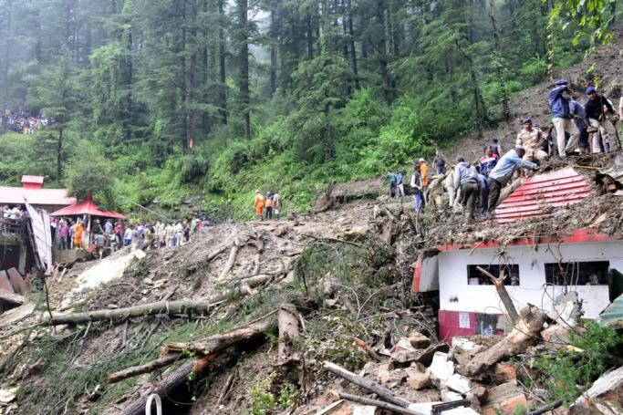 Rescue workers gather at the scene after a temple collapsed due to a landslide near Shimla, Himachal Pradesh, northern India, 14 August 2023. Photo: EPA