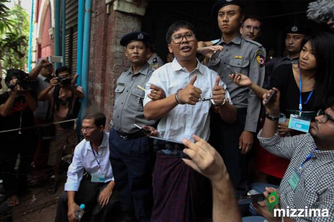 Detained Reuters journalist Wa Lone (C) talks to the media as he leaves after the trial at the court in Yangon on 02 May 2018. Photo: Thura/Mizzima
