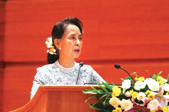 State Counsellor Daw Aung San Suu Kyi addresses the 2019 Conference on Implementing Development of Universities in Nay Pyi Taw yesterday. Photo: MNA
