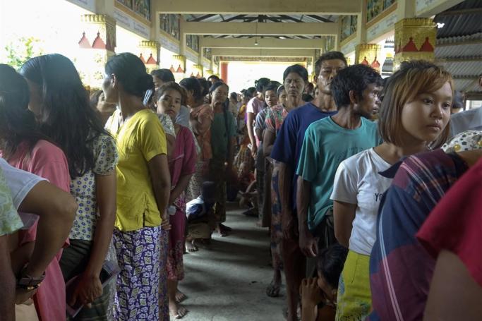 People queue for food at a monastery used as a temporary shelter in Sittwe, Rakhine State, Myanmar, 13 May 2023. Photo: EPA