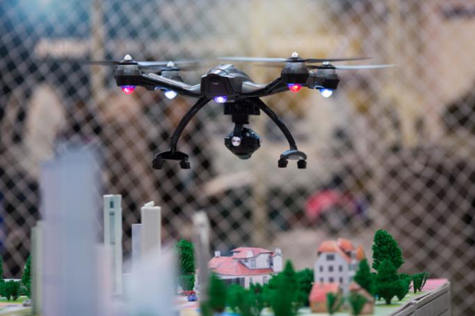 An exhibitor flies a drone during a demonstration at the electronicAsia 2015 electronics fair in Hong Kong, China. EPA/JEROME FAVRE
