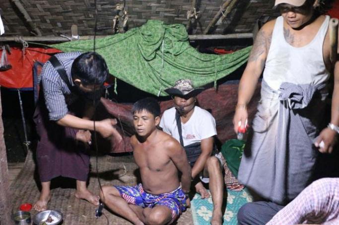 Police raid the house of Maung Maung Oo in Western Khone Thar Village near Kalay, Sagaing Region, on June 26. He was arrested earlier for drug possession, but no drugs were found in his home. Photo: Swe Win/Myanmar Now
