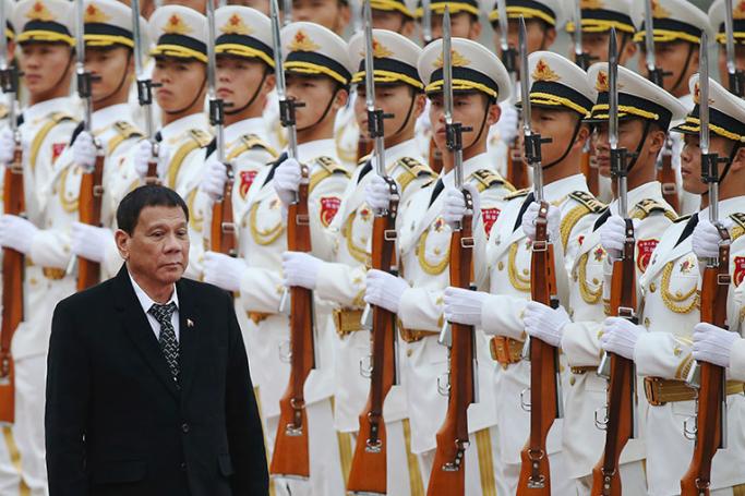 Philippines President Rodrigo Duterte (L) and his Chinese counterpart Xi Jinping (not pictured) review honor guards during a welcome ceremony at the Great Hall of the People in Beijing, China, 20 October 2016. Photo: How Hwee Young/EPA
