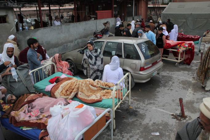 People injured in 7.7 magnitude earthquake receive medical treatment outside a hospital in Abbottabad, Pakistan, 26 October 2015. Photo: Sultan Dogar/EPA
