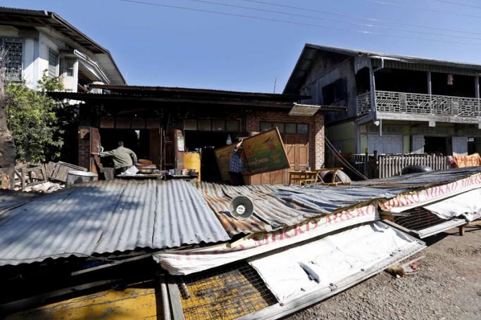 A quake can hit at any time - People clear the debris at their house in TaBaitGine Township, Mandalay Division, Myanmar, 12 November 2012. Photo: Nyein Chan Naing/EPA

