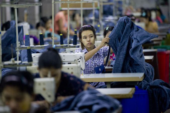 Employees work at the Shweyi Zabe garment factory in Shwe Pyi Thar Industrial Zone in Yangon. Photo: Ye Aung Thu/AFP
