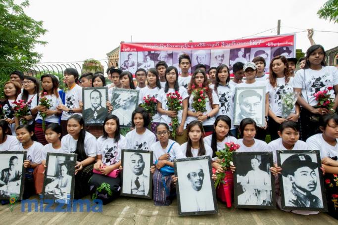Members of a Muslim Youth Group display portraits of the fallen Martyrs' outside Old Ministerial building. Photo: Hong Sar/Mizzima
