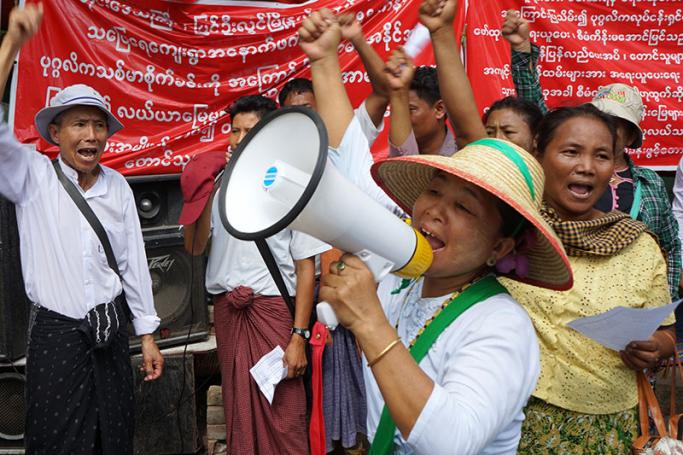 A female demonstrator shouts into a megaphone during the protest in Mandalay, in Central Myanmar on July 12, 2017. Photo: Kway Zay Win/AFP
