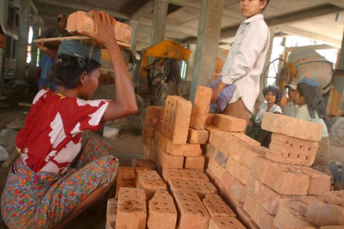 Female construction workers at work on a building site in Yangon. Photo: EPA
