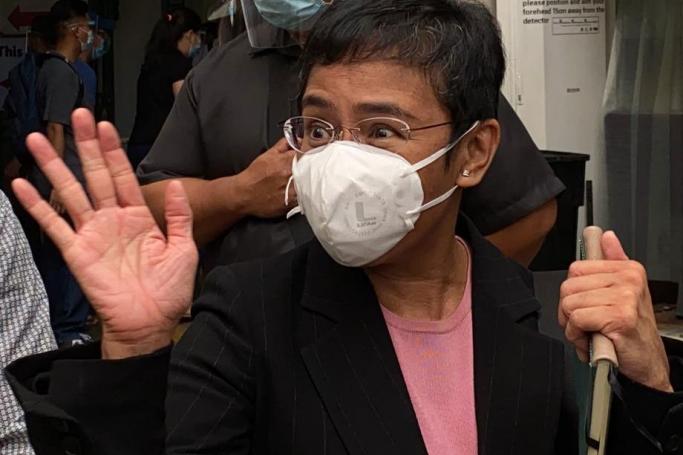 (File) Maria Ressa, Chief Executive Officer (CEO) and Executive Editor of online news site Rappler, gestures as she speaks to the media after attending a hearing outside a regional trial court in Manila, Philippines, 11 March 2021. Photo: EPA