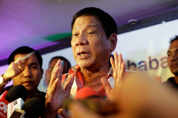Filipino presidential candidate Davao City Mayor Rodrigo Duterte answers questions during a press conference after he cast his vote for the National Election Day in Davao city, southern Philippines, 09 May 2016. Photo: Ritchie B. Tongo/EPA
