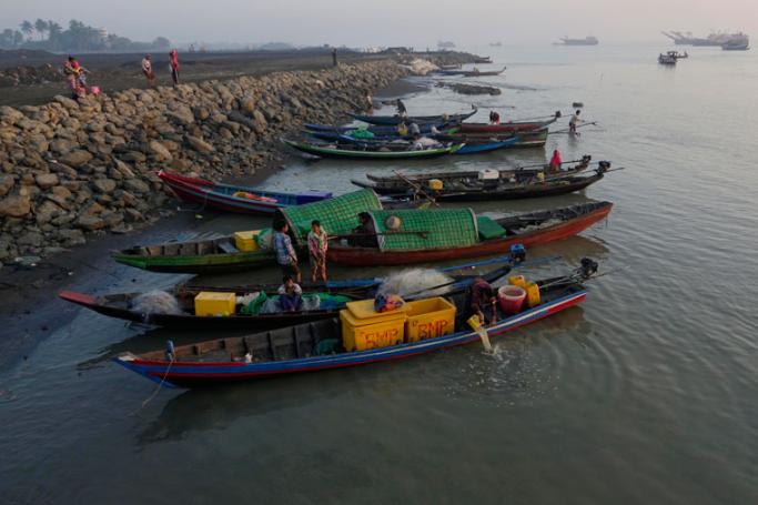 (File) Fishing boats arrive in the morning at a jetty near the market in Sittwe, Rakhine State, western Myanmar. Photo: Nyunt Win/EPA
