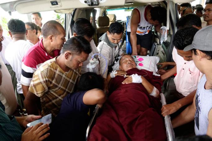 An injured monk is brought to the Sittwe Hospital in Sittwe, Rakhine State, Myanmar, 01 October 2019. Five people were reportedly injured after Myanmar security forces opened fire in the village of Mein Wa near Kyauk Taw township. According to local media reports, approximately 50,000 people have fled to temporary camps in recent weeks as fighting continues in the restive Rakhine state. Photo: Nyunt Win/EPA