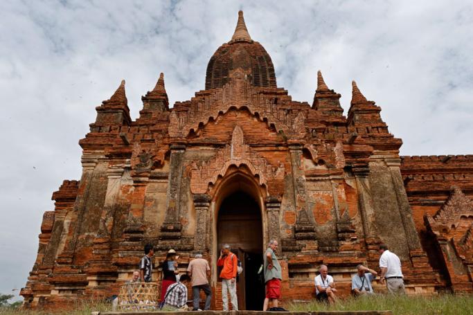 Foreign tourists visit Tham Bula Temple in Bagan city, Myanmar. Photo: Rungroj Yongrit/EPA
